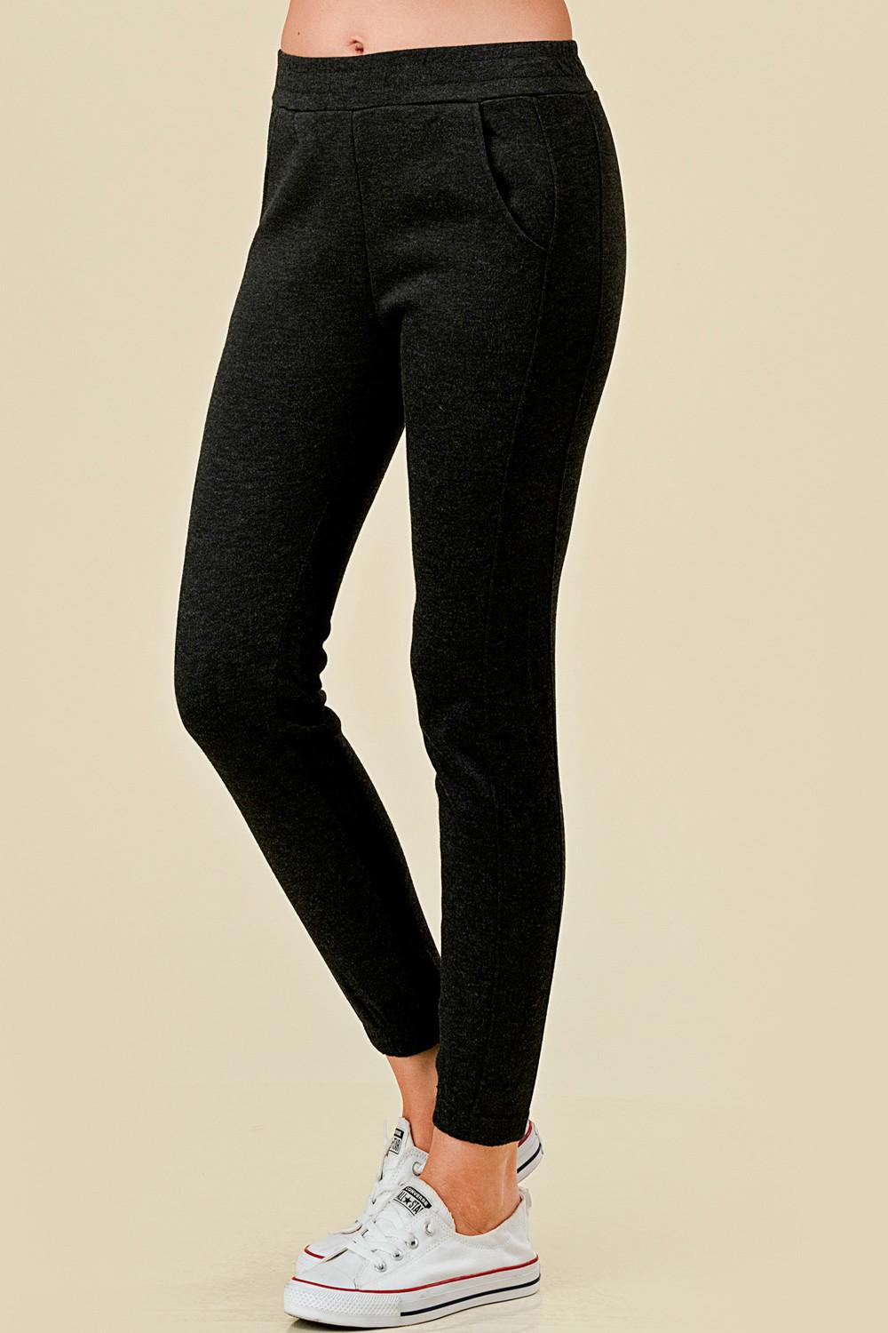 Women’s fleece lined black jogger sweatpants with side pockets, and slim tapered ankle fit